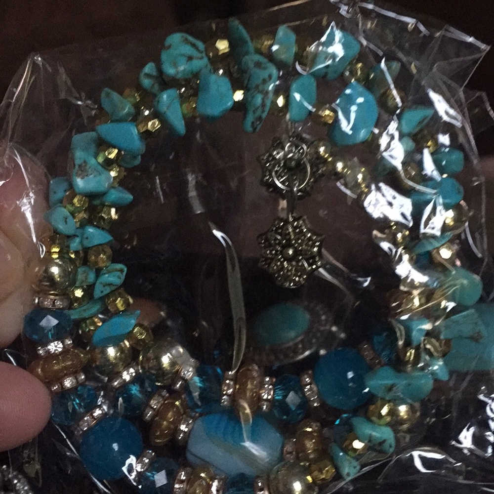 Blue and gold bracelet with multiple beads & stone